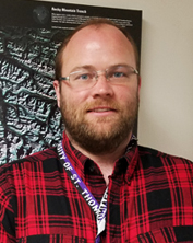 Picture of Jacob wearing a red flannel shirt.