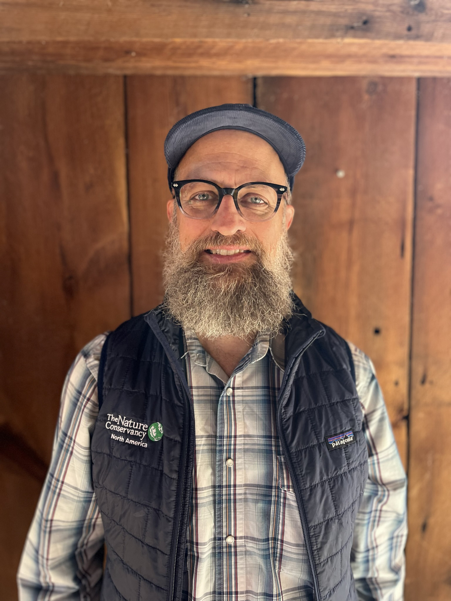 Picture of Randy in front of a wood door.
