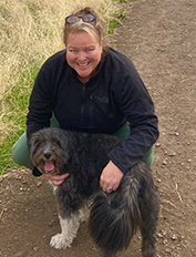 Picture of Brenda with her dog.