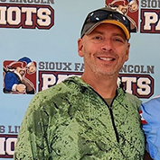 Picture of Brian with a baseball cap.