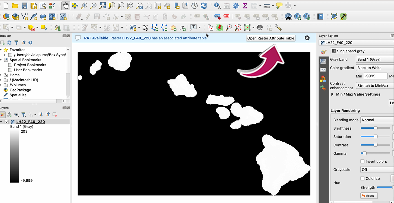 A screenshot of QGIS with an arrow pointing to the location to open a table.